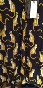 Black and mustard colored blouse with l cheetahs